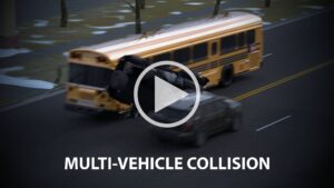 Bus and car crash on a road in a multi-vehicle collision; overlay text reads MULTI-VEHICLE COLLISION.